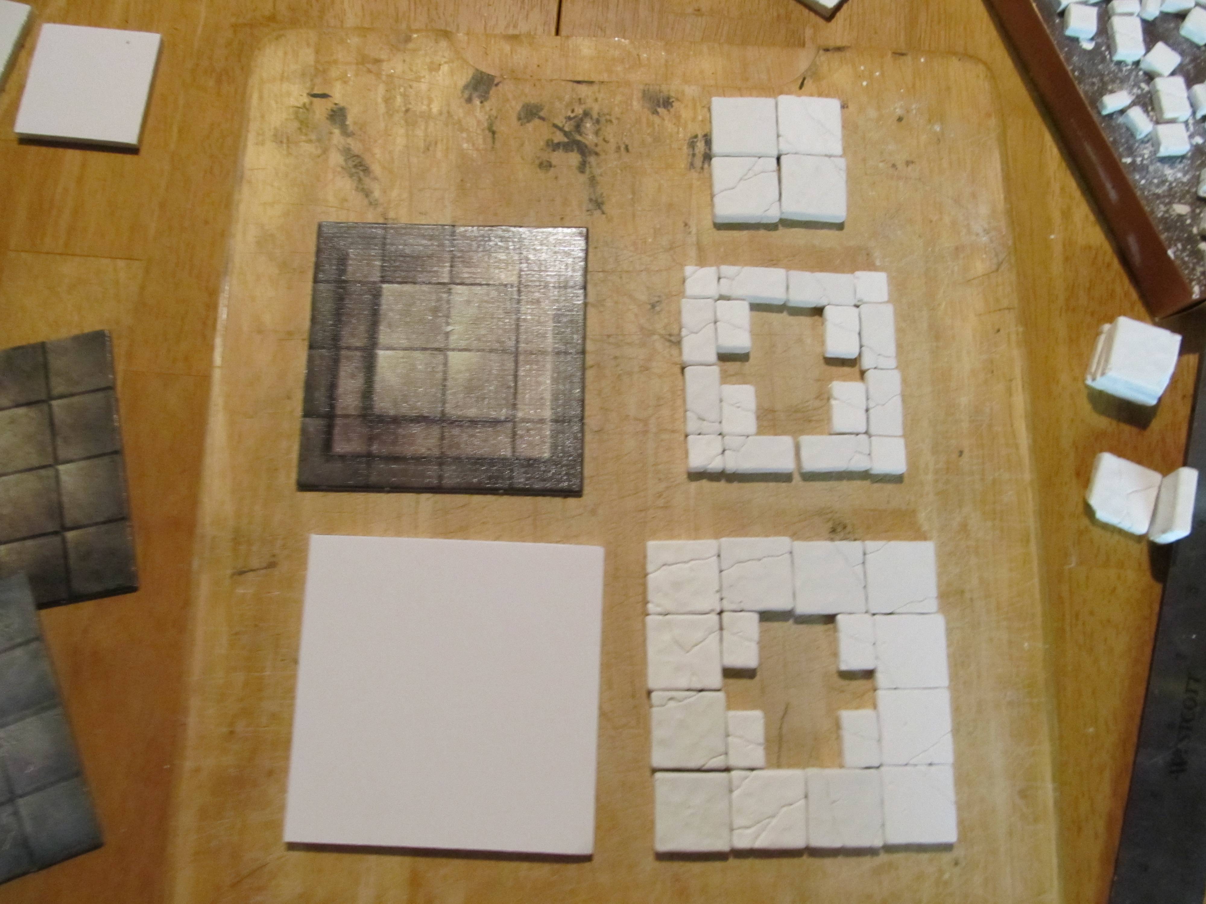 Planning prevents mistakes when it comes time to gluing. Here are the pieces laid out for the pedastal.